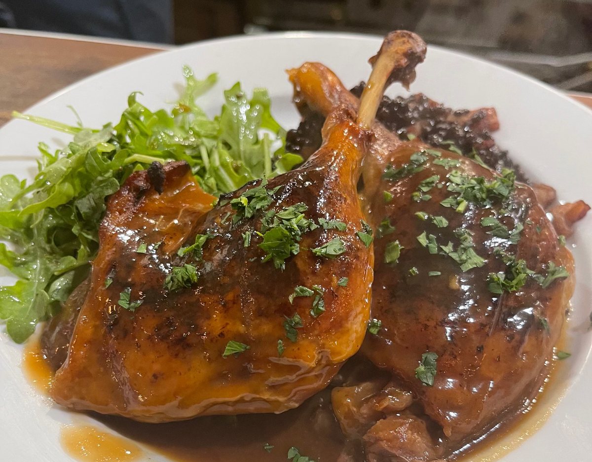 Duck confit with black lentils and arugula at Bistro Moulin, Monterey