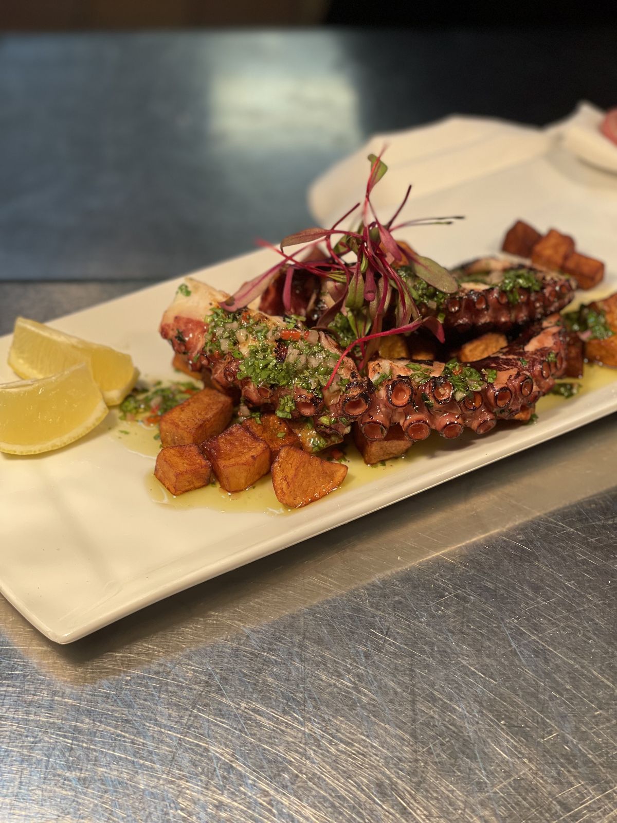 Grilled octopus with roasted potatoes