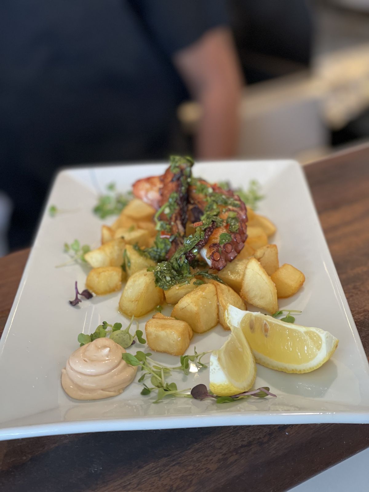 Octopus with crispy potatoes and lemon