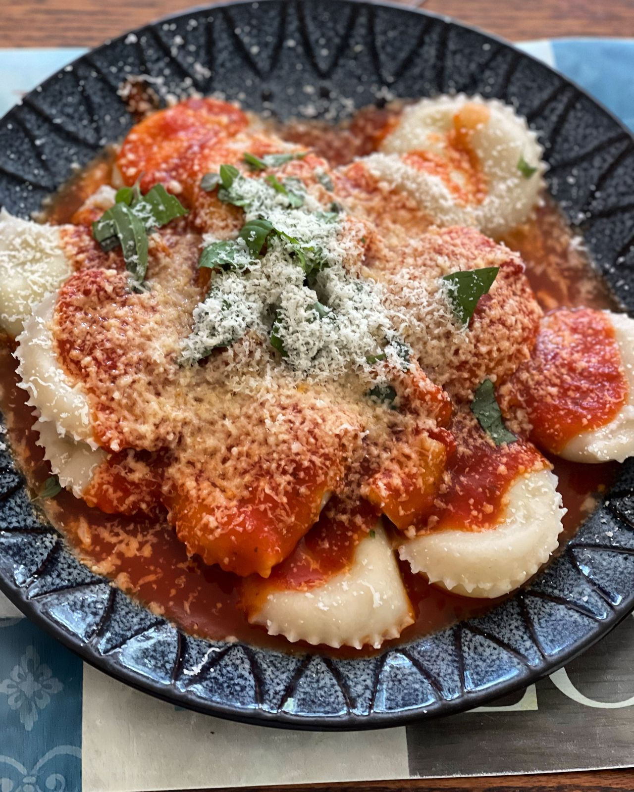 Ravioli in tomato sauce with parmesan