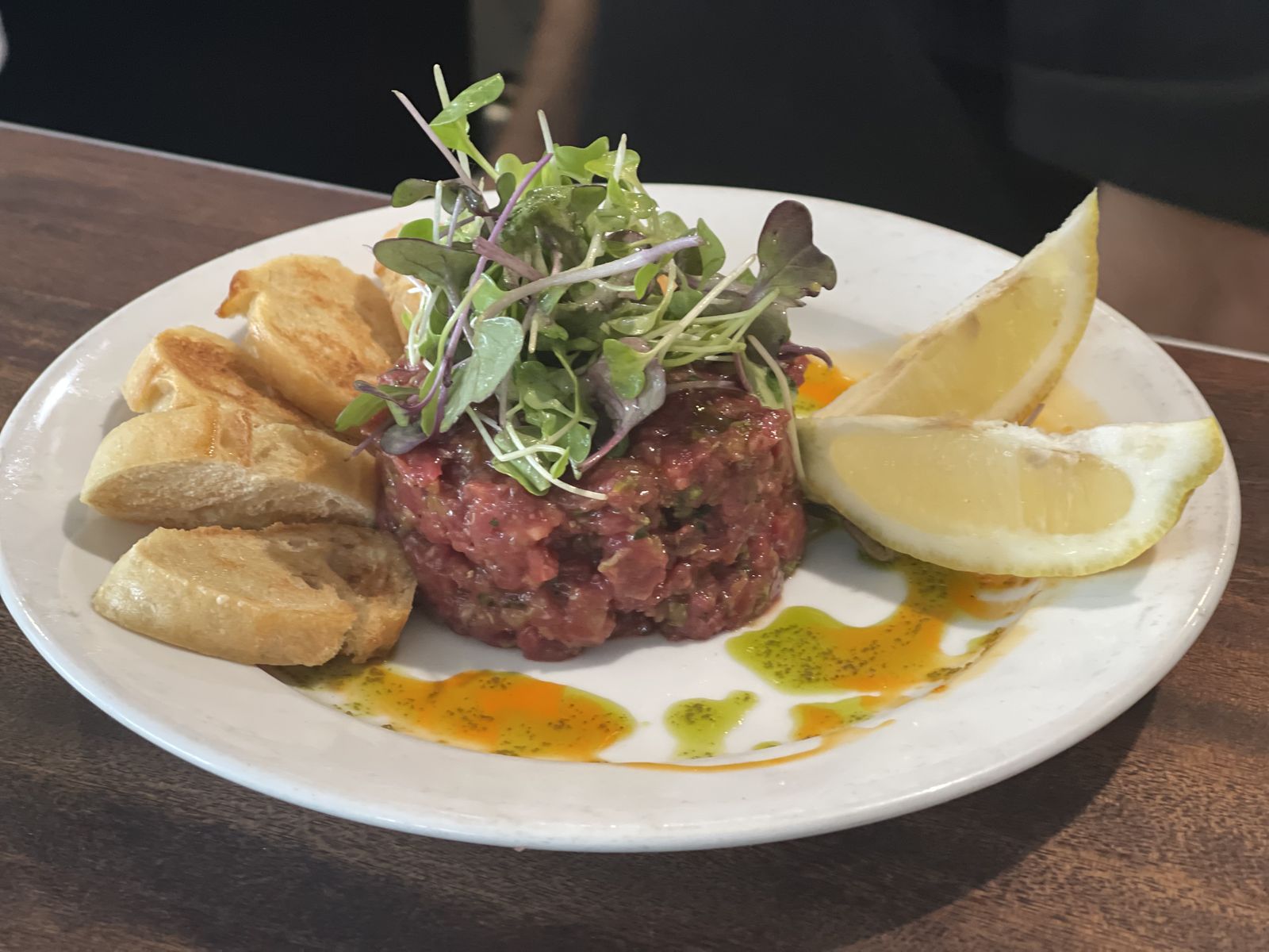 Steak tartare with toast and lemon